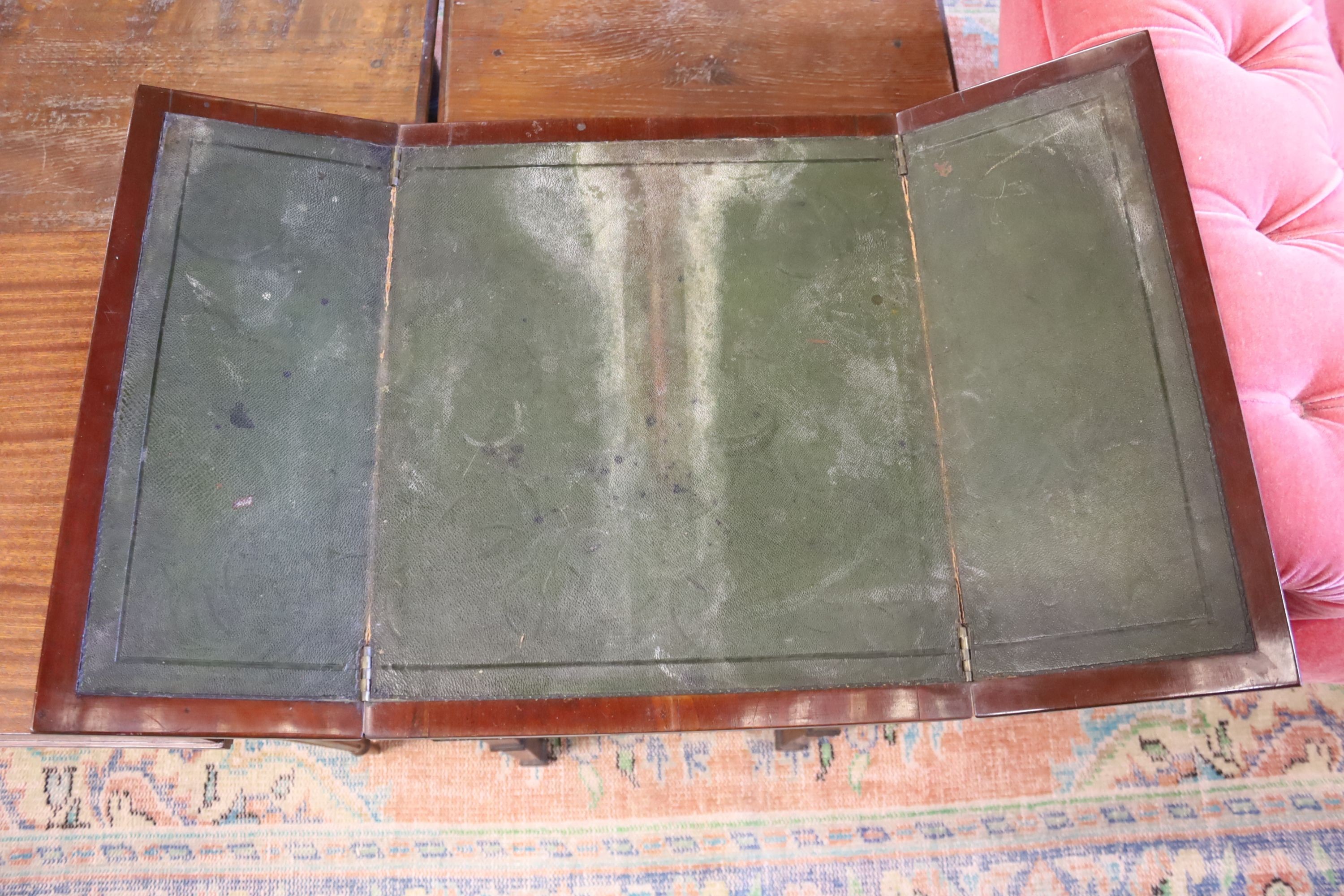 A Victorian mahogany writing/work table with twin hinged flap top, width 42cm, depth 50cm, height 77cm